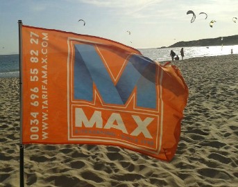 Tarifa Max kitesurfing school beach flag at Vadevaqueros beach in Tarifa Spain. Contact info@tarifa max.net or call 0034 696 558 227